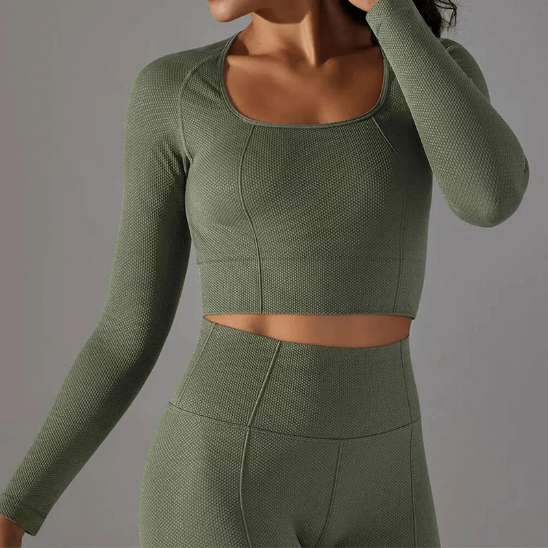Olive green women's seamless bodycon crop top with long sleeves, ideal for yoga, running, and cycling. Model wearing athleisure set SF1686.